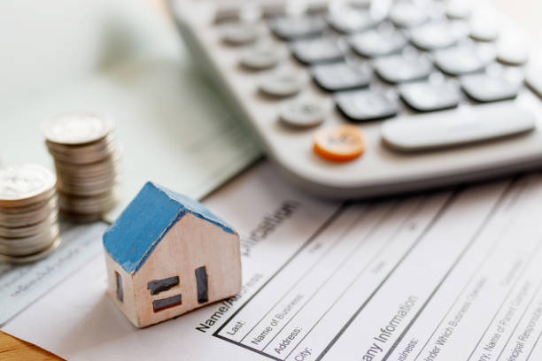 Home insurance paperwork with a calculator
