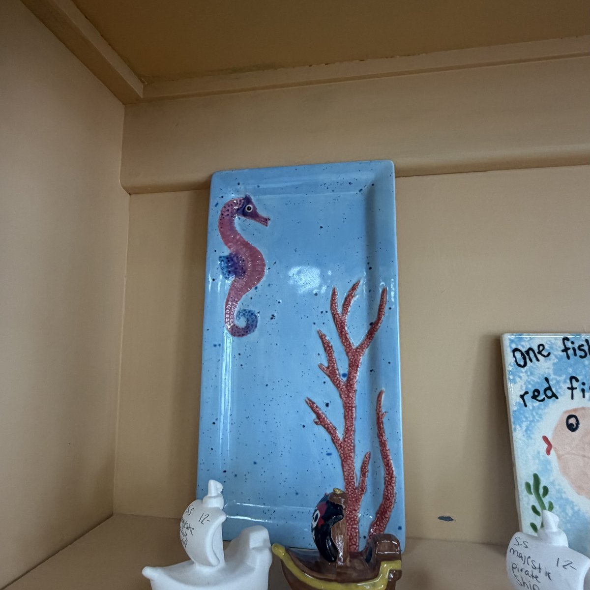 A hand painted seahorse platter at Midnight Star Pottery in Richmond Hill, Georgia