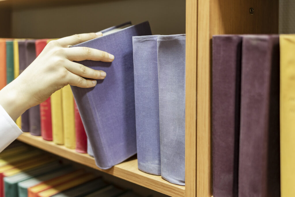 Taking a book from a school library shelf