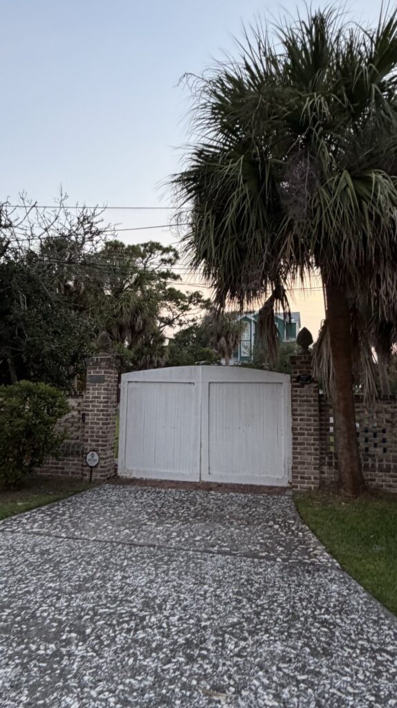Brick wall gate with palm trees at a Tybee Island home, Savannah GA